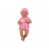 Baby doll in pink clothes, hat, pacifier, and blanket