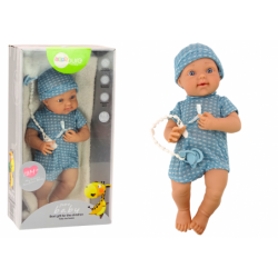 Baby doll in blue clothes, hat, pacifier, and blanket