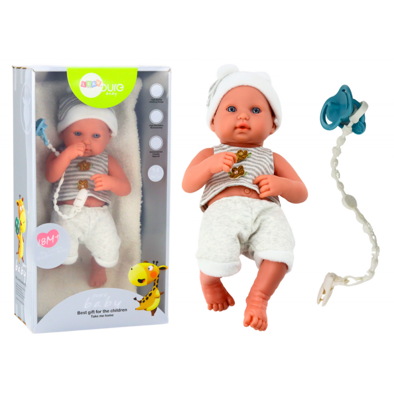 Baby doll in white and gray clothes, hat, pacifier, and blanket