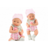 Baby doll in white and pink clothes, hat, pacifier, bib, quilt