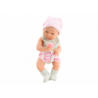 Baby doll in white and pink clothes, hat, pacifier, bib, quilt