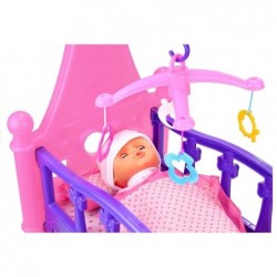 Rocking bed with doll and bedding mobile included